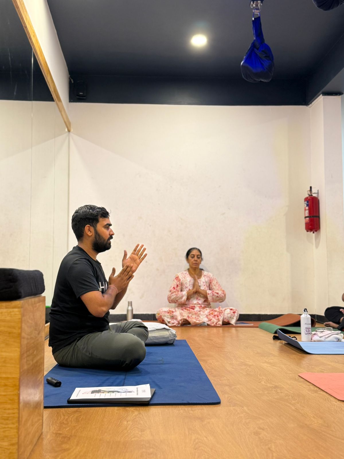 Vikrant Dubey, founder of Hamsa Yoga Studio, leading a guided practice